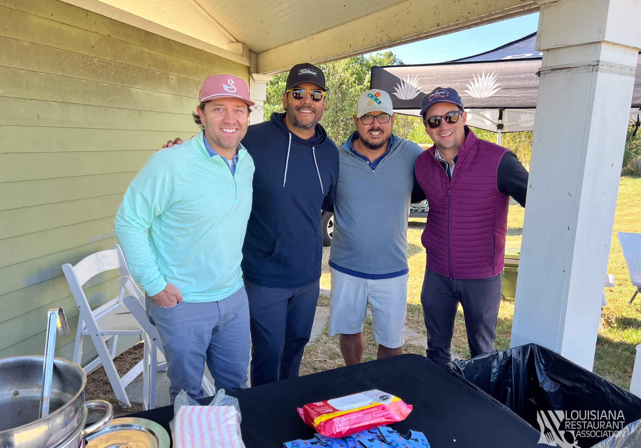 Four golfers enjoying a nice day