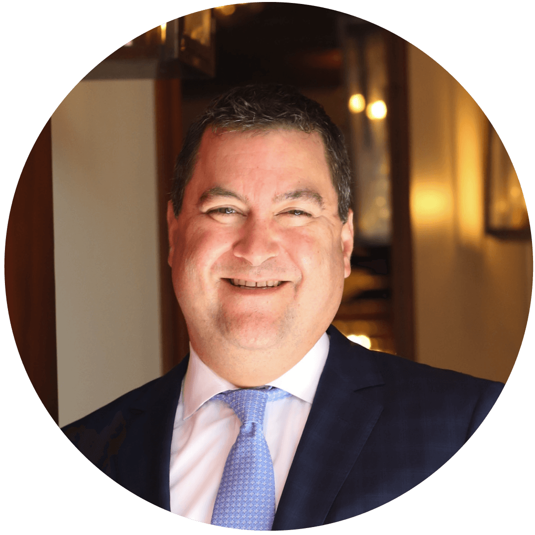 white male, happily smiling, squinted eyes, rosy cheeks, blue tie, white shirt